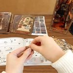 magical-bookshelf-insert-with-intricate-handcrafted-design Handcrafted book nook for bookshelf display showing laser-cut basswood panels