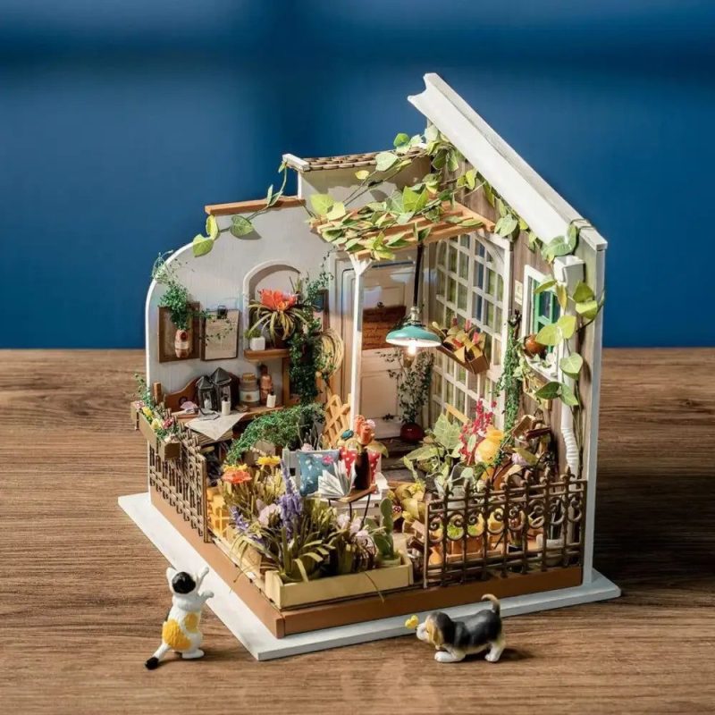 miller-s-garden-diy-miniature-house-kit Miller's Garden DIY miniature house kit with ceramic pots and plant stems arranged on resin base