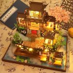 mini-japanese-house-zen-decor-for-desk Mini Japanese house zen decor placed on wooden desk with LED glow
