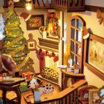 Miniature Christmas book nook diorama showing detailed holiday scene between books