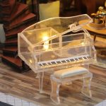miniature-cottage-model-for-diy-craft-projects Miniature cottage interior showing scaled furniture, room divisions, and detail texture