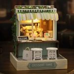 miniature-dessert-shop-dollhouse-kit Miniature dessert shop facade with layered pastry counter display and cream vintage storefront details