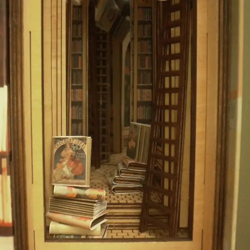 miniature-fantasy-library-with-elf-figurine miniature fantasy library with elf figurine