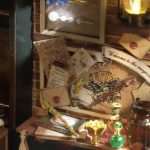 miniature-house-model-kit-with-detailed-furniture-and-accessories Miniature house model kit interior showing detailed furniture props and wand accessories