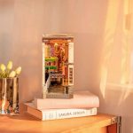 miniature-japanese-street-book-nook-with-led-lights Miniature Japanese street book nook with warm LED lights glowing at night