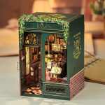miniature-library-corner-with-owl-and-warm-lighting Miniature library corner diorama with owl motif and warm amber LED lighting
