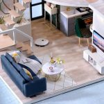miniature-living-room-kit-for-dollhouse-enthusiasts Miniature living room kit for dollhouse enthusiasts featuring wall details and warm lighting