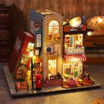 Miniature London street diorama book nook with layered Victorian facades