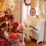 miniature-seasonal-village-house-craft-kit-with-accessories Miniature seasonal village house craft kit with matching accessories bundled and ready to assemble