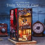 miniature-train-book-nook-diorama-for-bookshelf miniature train book nook diorama inserted between books on bookshelf