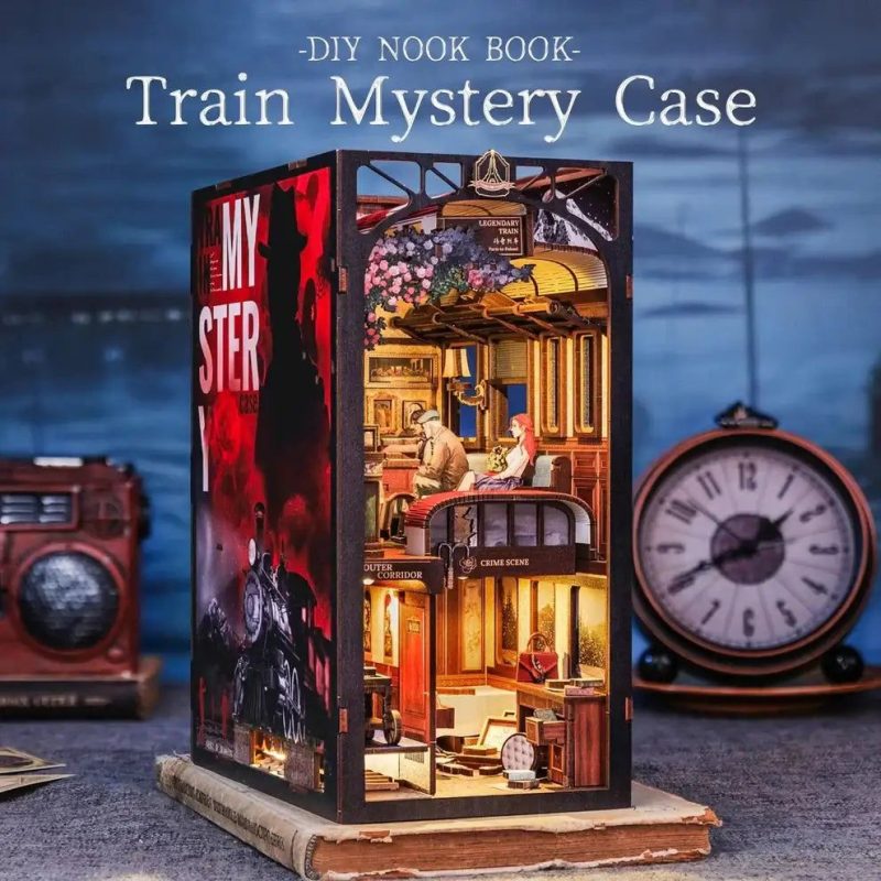 miniature-train-book-nook-diorama-for-bookshelf miniature train book nook diorama inserted between books on bookshelf