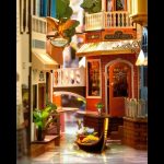 miniature-venetian-canal-book-nook-for-bookshelf-decor Miniature Venetian canal book nook with 3D resin water and gondola for bookshelf decor