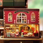Miniature wooden house craft project with furniture pieces