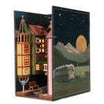 nighttime-illuminated-book-nook-with-cobblestone-street Nighttime illuminated book nook with cobblestone street and warm glow from LED lights