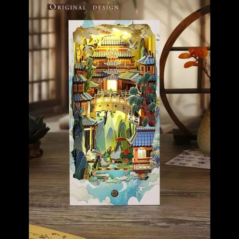 ornamental-chinese-landscape-diorama-for-book-lovers-shelf Ornamental Chinese landscape book nook diorama between hardcover books