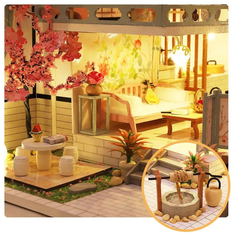 Guqin Pavilion miniature displayed on home bookshelf styled with books and natural light