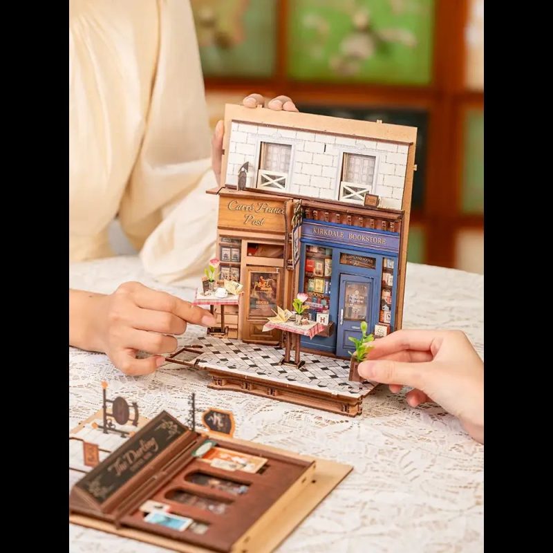 romantic-arcade-miniature-for-bookshelf-display Romantic arcade miniature for bookshelf display featuring period-accurate Parisian café scene with tiny furniture and details