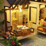 scale-model-bamboo-courtyard-garden-for-dollhouse-display 1:24 scale bamboo courtyard garden model kit displayed on wooden shelf