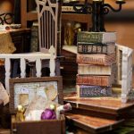 scale-model-dollhouse-with-realistic-mini-furniture Scale model dollhouse with realistic miniature furniture pieces and working door hinge