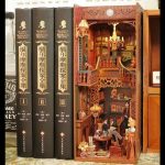 Sherlock inspired bookshelf vignette with lamp, armchair, and miniature detective accessories