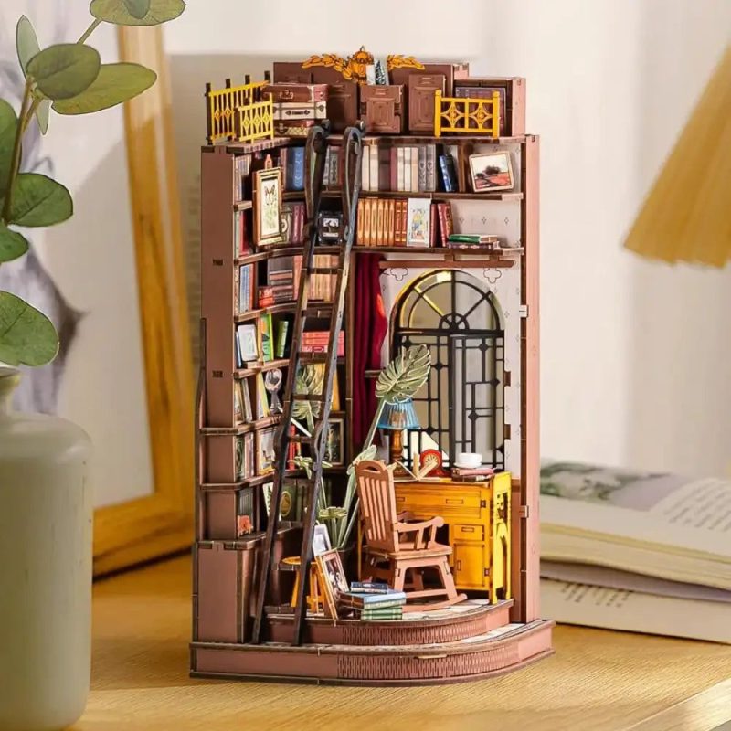 silent-corner-study-diy-wooden-book-nook-kit Silent Corner Study wooden book nook kit glowing between hardcover books on bookshelf