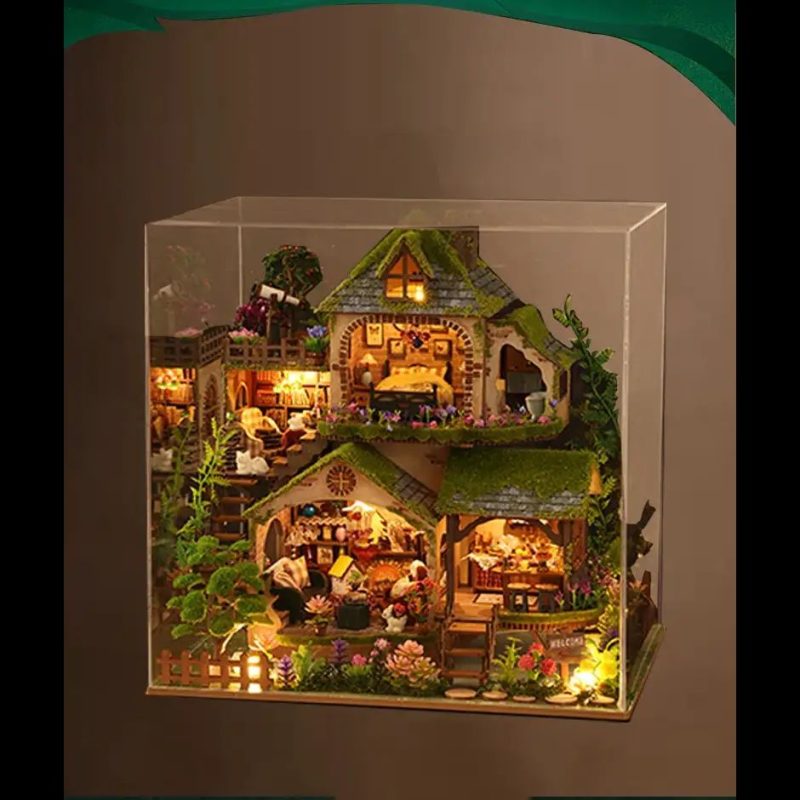 tabletop-fairy-cottage-diy-kit-with-warm-led-lighting Tabletop fairy cottage DIY kit showing warm LED glow through tiny windows