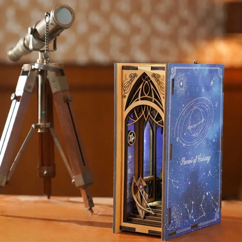 the-secret-of-the-galaxy-book-nook-kit The Secret of the Galaxy Book Nook Kit on a wooden bookshelf