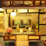 tiny-bamboo-courtyard-model-kit-for-diy-diorama Tiny bamboo courtyard model kit parts laid out for DIY diorama assembly