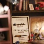 tiny-fairy-tale-house-diy-kit-for-home-decor-and-display Tiny fantasy wand shop DIY kit lit by warm amber LED for home shelf display