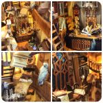 tiny-illuminated-fantasy-village-bookshelf-ornament Tiny illuminated fantasy village bookshelf ornament with amber glow