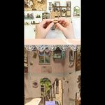 tiny-storybook-alley-bookshelf-diorama Tiny storybook alley bookshelf diorama with rustic fence and lantern