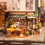 Tipsy dollhouse bistro DIY kit displayed on bookshelf desk decor