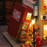 Victorian London alley shelf insert showing cobblestone foreground and shopfronts
