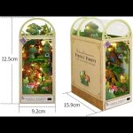 whimsical-woodland-vignette-to-enhance-bookshelf-decor Glowing woodland book nook vignette tucked between hardcover books on home library shelf