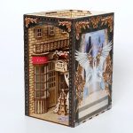 Wizarding street book nook insert between paperbacks on shelf